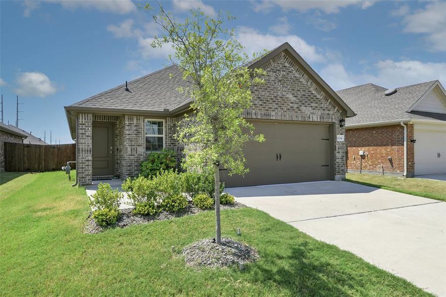 Front exterior of a new home in , Lavon, TX, highlighting curb appeal (Image 1).