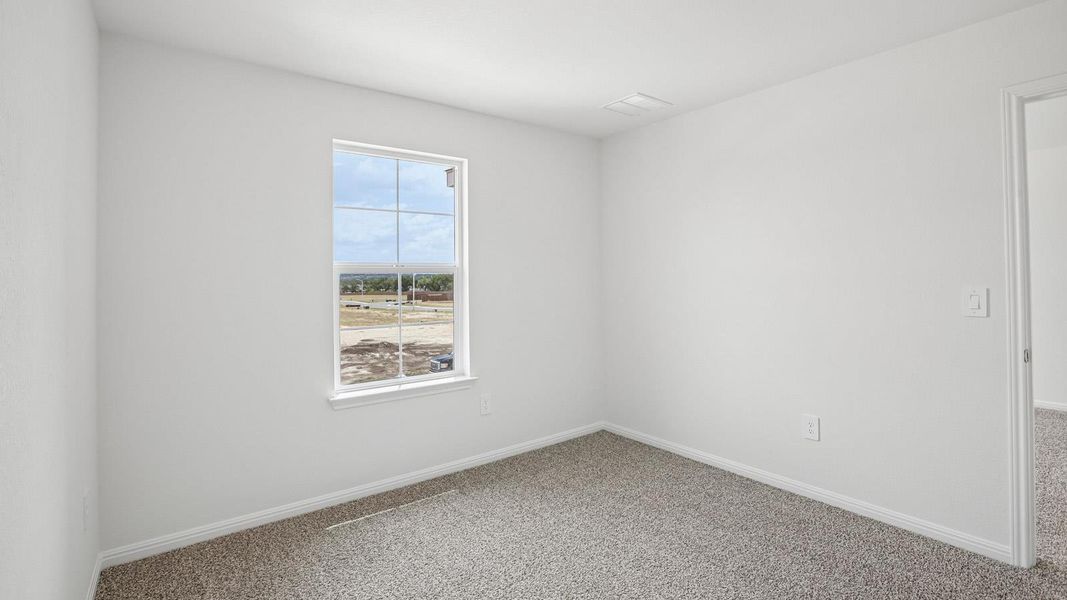 Spacious, unfurnished interior of a new home in Bar W Ranch, Leander (Image 28).