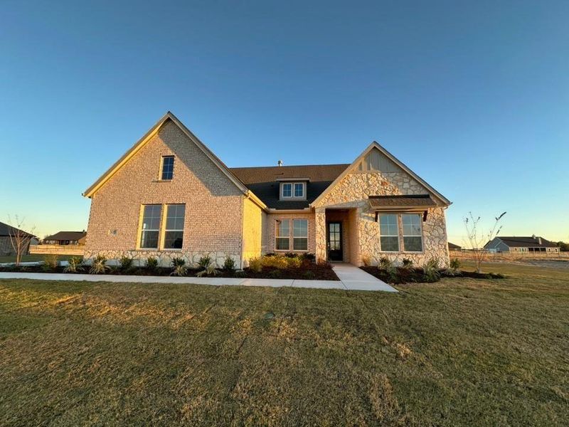 Front exterior of a new home in Eagle Ridge Estates, Weatherford, TX, highlighting curb appeal (Image 2).