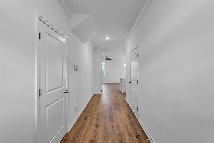 This bright hallway connects various living spaces This bright hallway connects various living spaces