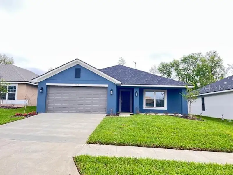 Front exterior of a new home in Abbey Glen, Dade City, FL, highlighting curb appeal (Image 2). Front exterior of a new home in Abbey Glen, Dade City, FL, highlighting curb appeal (Image 2).