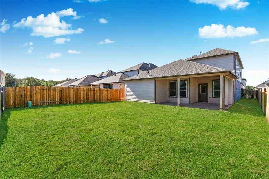 Come and see this spacious backyard with its beautiful covered patio. There is plenty ofroom for the kids to play and adults to relax. Perfect for your outdoor living space, patiofurniture, bbq pit, and so much more. The possibilities are endless!