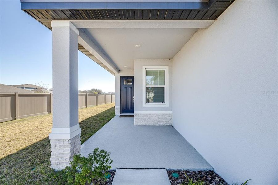 Exterior details and patio area of a home in The Grove at Stuart Crossing - Premier Series, Bartow (Image 20).