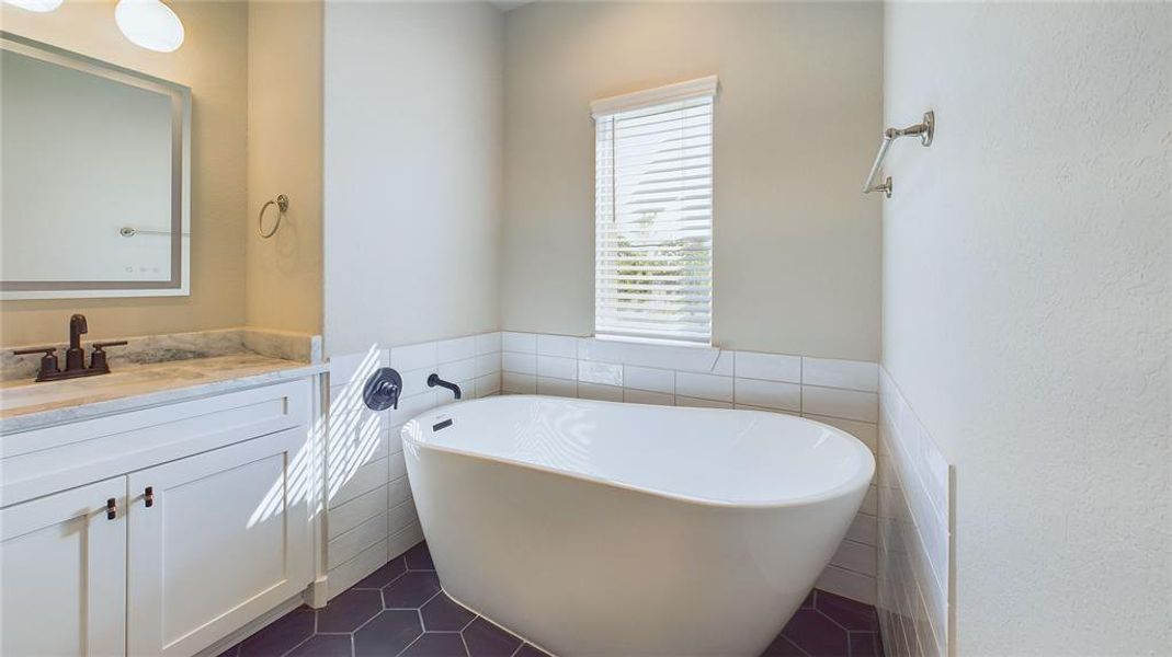 double sinks with a soaking tub and steam shower