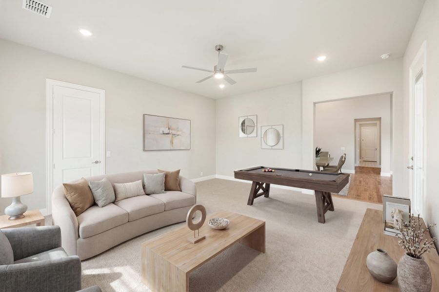 Game room with pool table, neutral sofa, ceiling fan, and carpet flooring