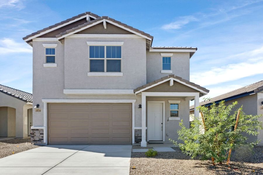 Front exterior of a new home in Blackhawk, Tucson, AZ, highlighting curb appeal (Image 1).