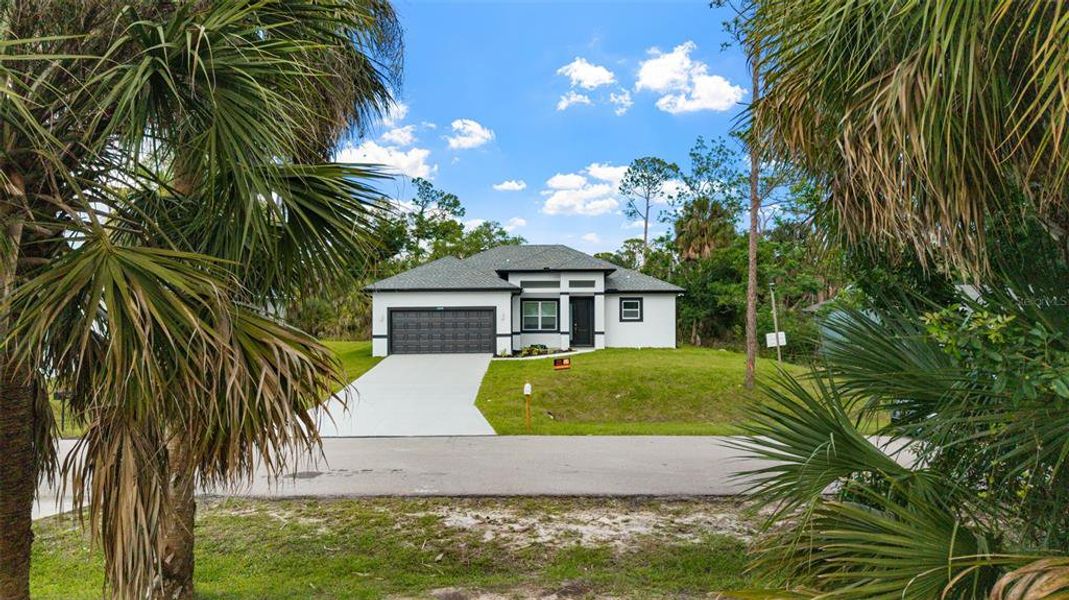 Front exterior of a new home in , Port Charlotte, FL, highlighting curb appeal (Image 19). Front exterior of a new home in , Port Charlotte, FL, highlighting curb appeal (Image 19).