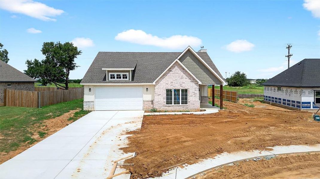 Front exterior of a new home in , Callisburg, TX, highlighting curb appeal (Image 19).