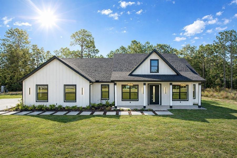Front exterior of a new home in , Dunnellon, FL, highlighting curb appeal (Image 27).
