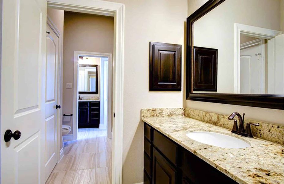 Representative furnished interior of a home built from the 4198 by Ravenna Homes in The Woodlands Hills 65′, Willis (Image 11).