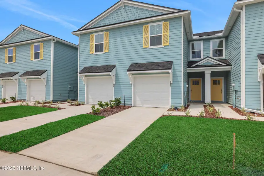 Front exterior of a new home in Atlantis Pointe, Middleburg, FL, highlighting curb appeal (Image 17).
