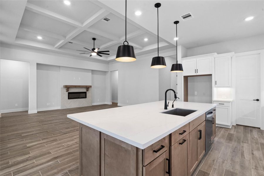 Perspective from the kitchen island, perfectly positioned to greet guests and family as they step into this grand, sun-drenched living space.