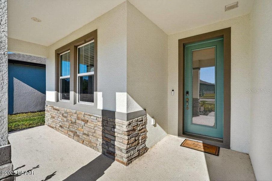 Exterior details and patio area of a home in Legends Preserve - Reserve Series, Daytona Beach (Image 4). Exterior details and patio area of a home in Legends Preserve - Reserve Series, Daytona Beach (Image 4).