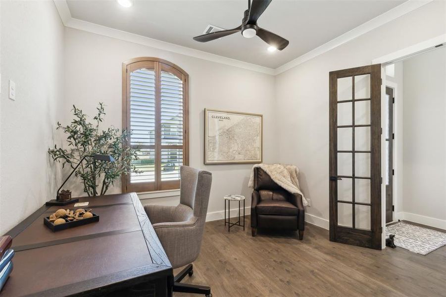 Office with crown molding, hardwood / wood-style floors, ceiling fan, and french doors