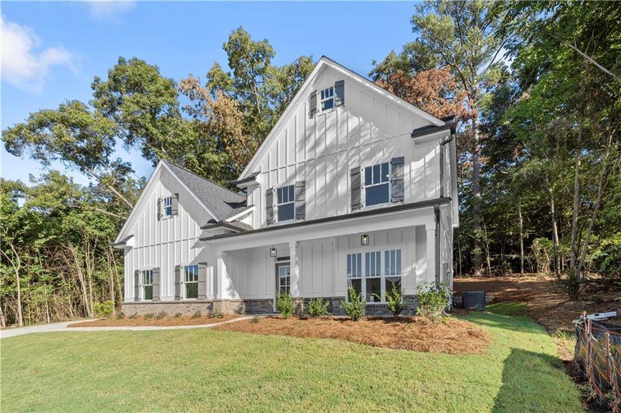 Front exterior of a new home in , Covington, GA, highlighting curb appeal (Image 22). Front exterior of a new home in , Covington, GA, highlighting curb appeal (Image 22).