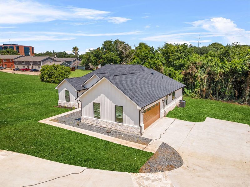 Front exterior of a new home in , Brenham, TX, highlighting curb appeal (Image 17).