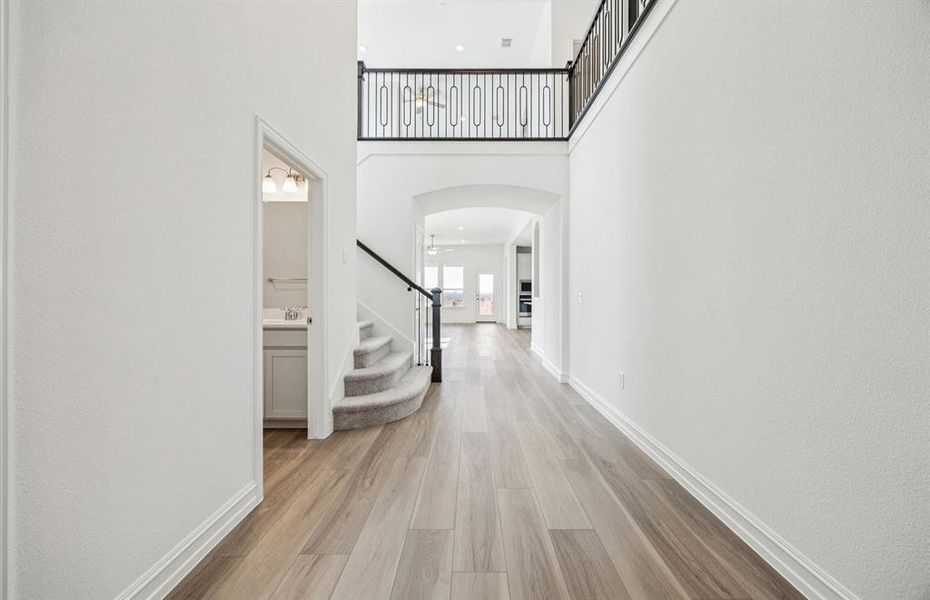 Welcoming entry with two-story ceilings