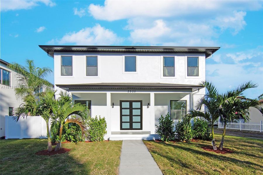 Front exterior of a new home in , St. Petersburg, FL, highlighting curb appeal (Image 2).