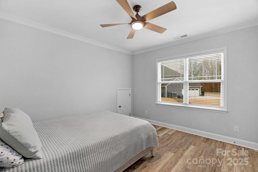 Secondary bedroom on the second level with walk-in closet