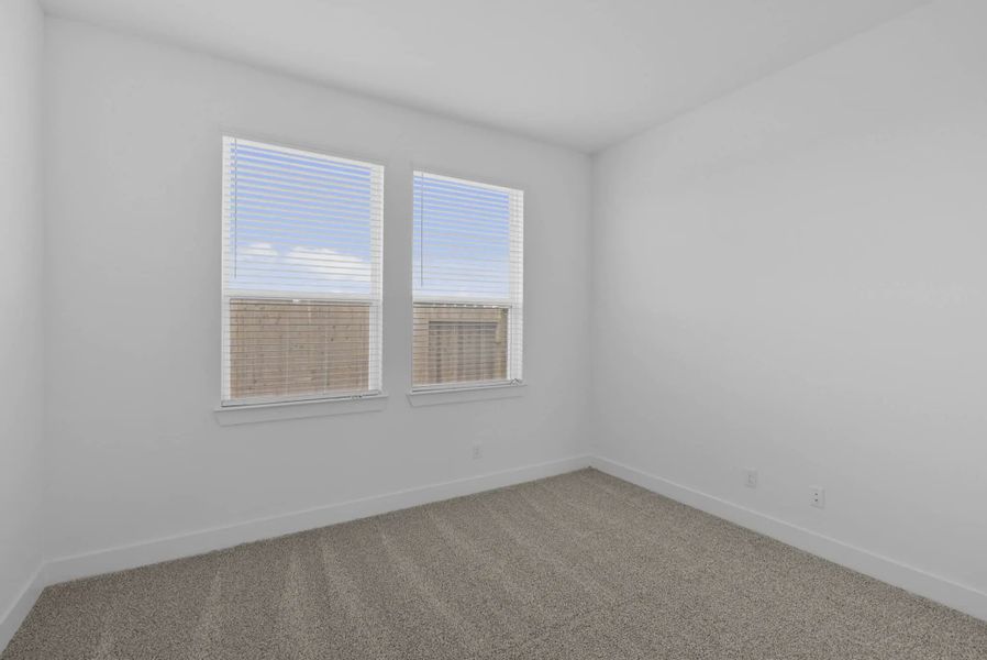 Representative unfurnished interior of a home built from the Nicklaus by Chesmar Homes in Riceland Alley Loads, Mont Belvieu (Image 68).