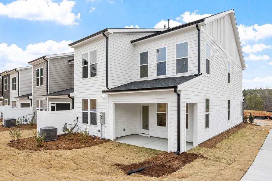 Exterior details and patio area of a home in Ovation at Sweetbrier, Durham (Image 4).