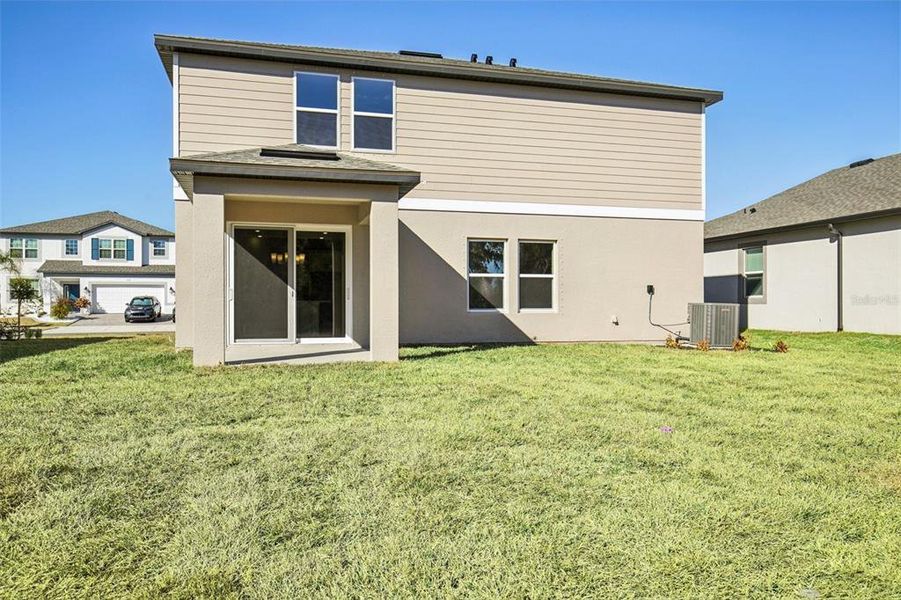 Exterior details and patio area of a home in Berry Bay, Wimauma (Image 22).
