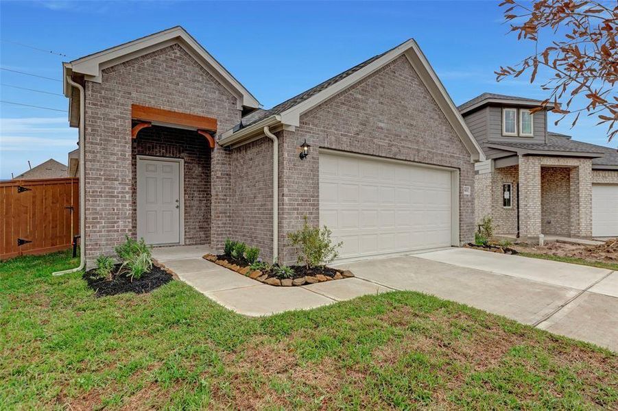 Front exterior of a new home in Marvida, Cypress, TX, highlighting curb appeal (Image 2).