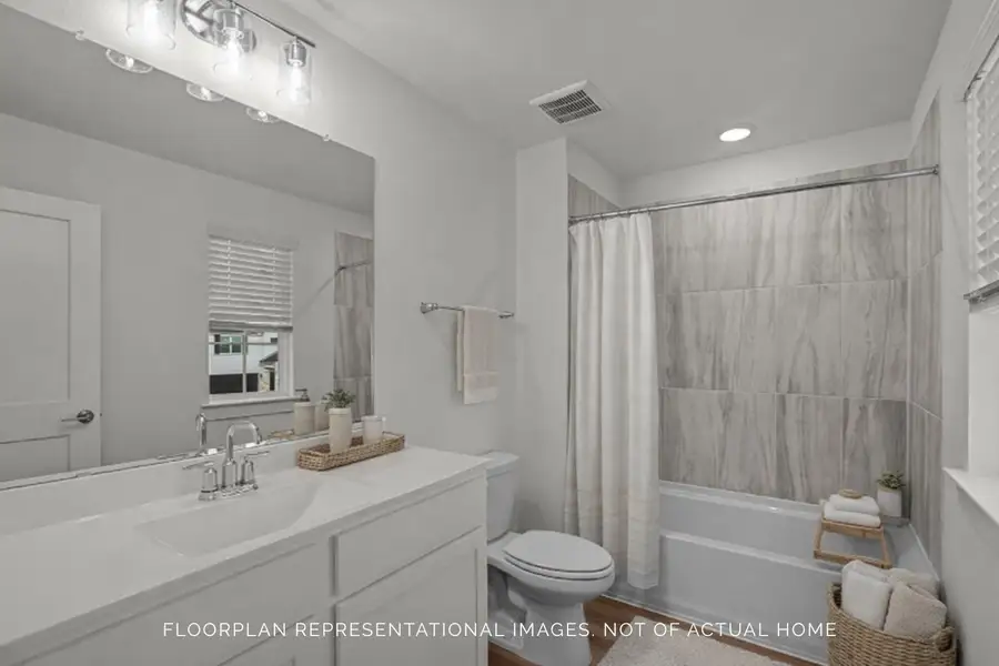 Furnished interior view inside a new home in The Oaks on 6th Street, Magnolia (Image 8).