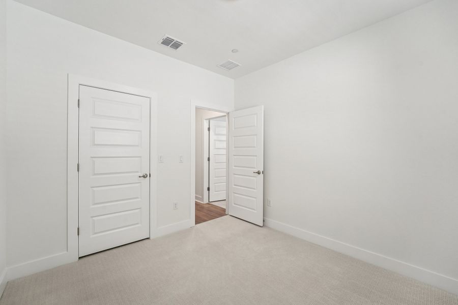 Spacious, unfurnished interior of a new home in Koenig Townhomes, Austin (Image 20).