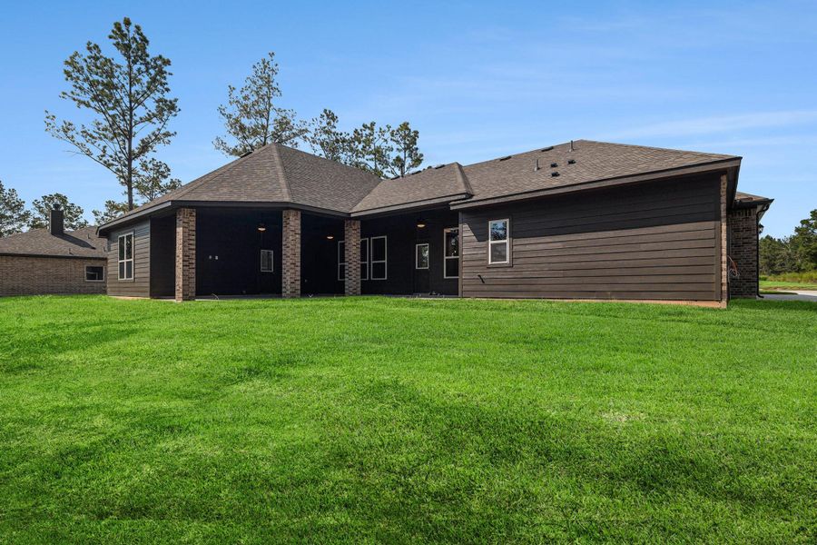Front exterior of a new home in Deer Pines, Conroe, TX, highlighting curb appeal (Image 15).