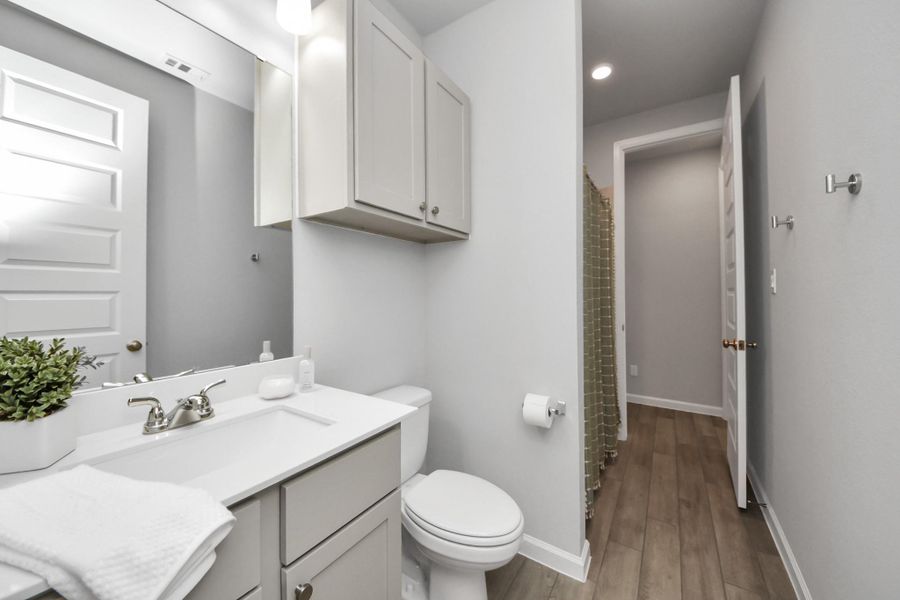Spa like bathroom with lots of custom storage.