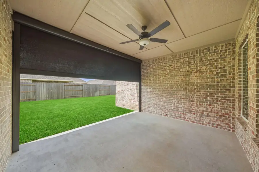 Large covered porch with roll down screen
