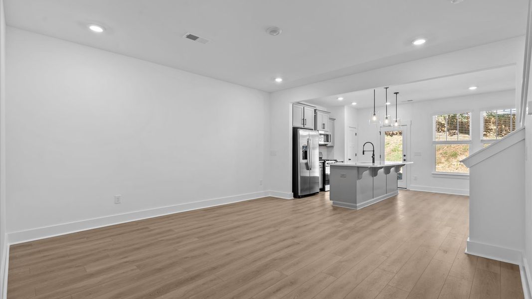 First-rate living space with tasteful hardwood floors and a functional open-concept design