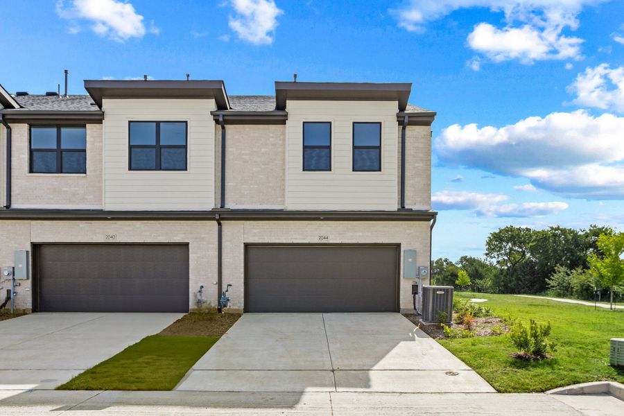 Front exterior of a new home in Ten Mile Creek, Celina, TX, highlighting curb appeal (Image 27).