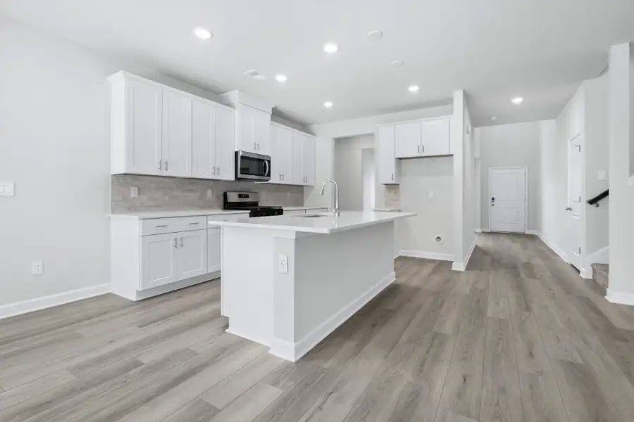 Furnished interior view inside a new home in Waterside - Coastline Series, Longs (Image 3). Furnished interior view inside a new home in Waterside - Coastline Series, Longs (Image 3).