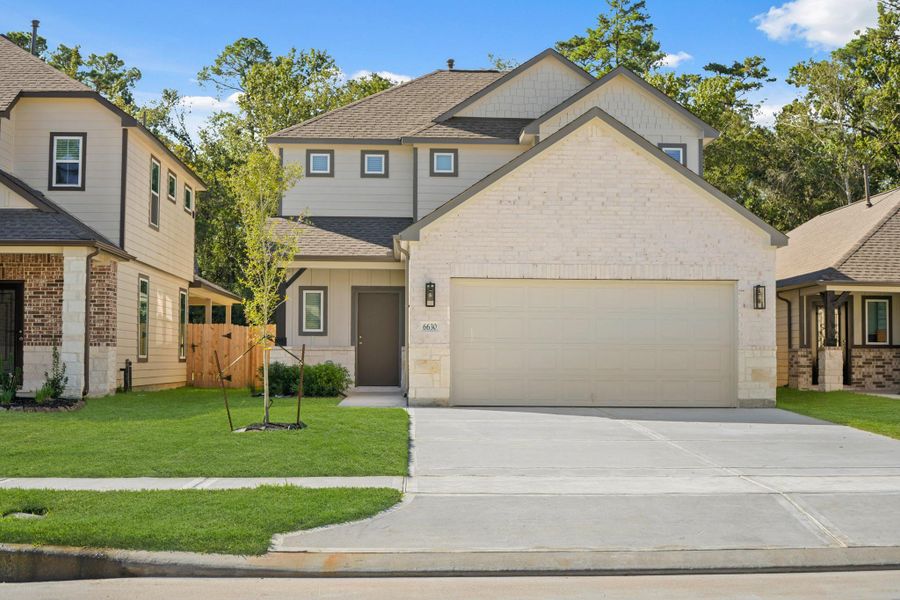 Front exterior of a new home in Cypresswood Landing, Humble, TX, highlighting curb appeal (Image 1).