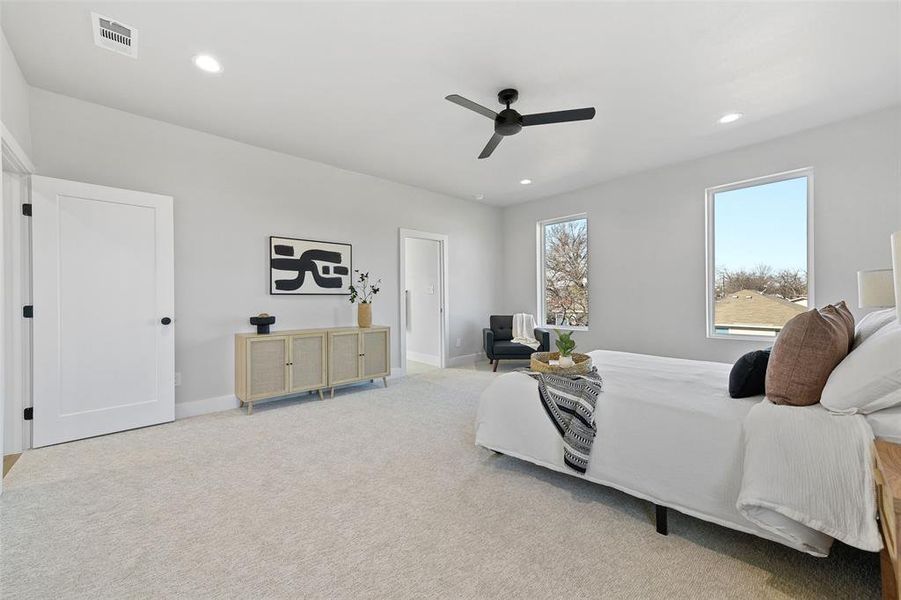 Bedroom with light carpet and ceiling fan