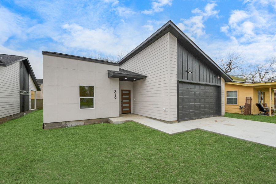 Two-car garage is fully pre-wired for auto-control and smart home features.