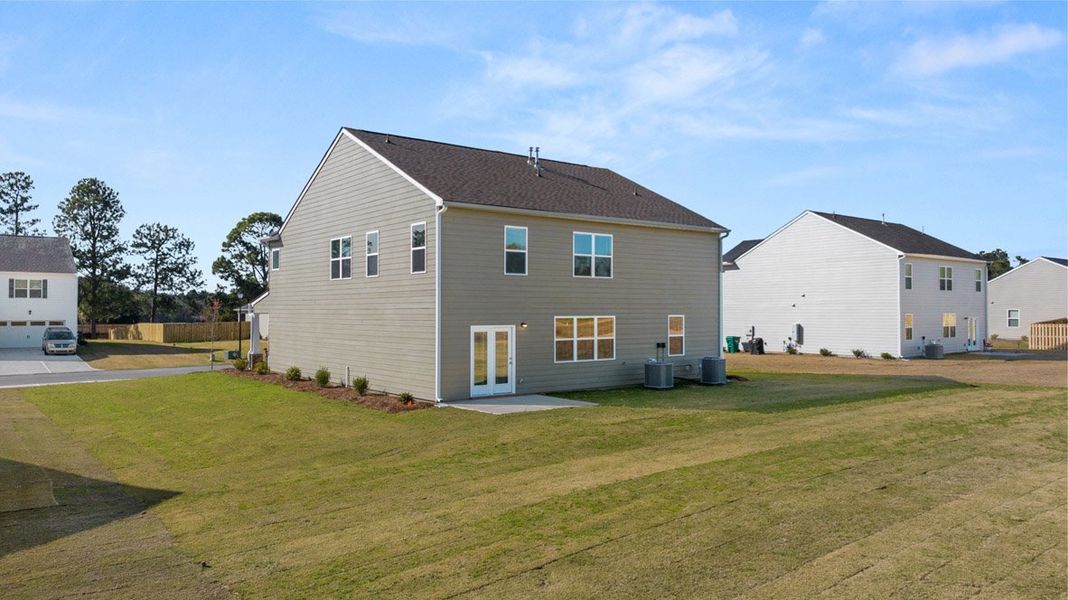 Front exterior of a new home in Southwind Village, Evans, GA, highlighting curb appeal (Image 22).