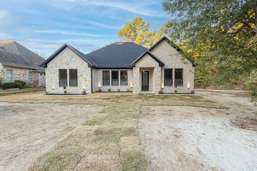 Front exterior of a new home in , Tyler, TX, highlighting curb appeal (Image 25).