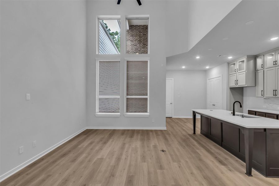 Open-concept view connecting the family room and kitchen.