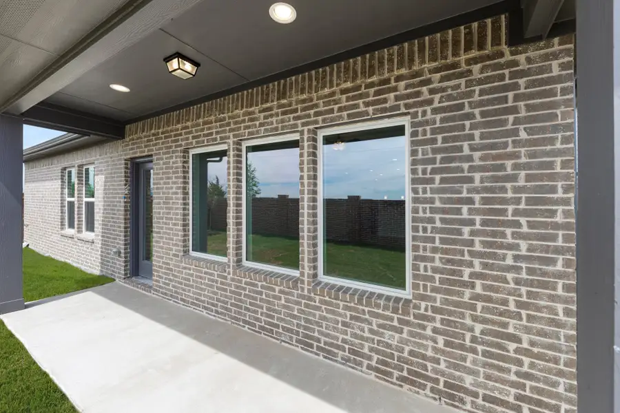 Exterior details and patio area of a home in Walden Pond, Forney (Image 3). Exterior details and patio area of a home in Walden Pond, Forney (Image 3).