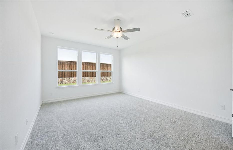 Spacious secondary bedroom with large windows