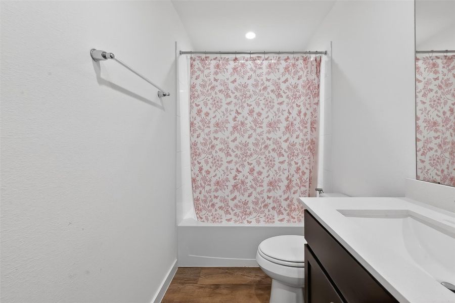 Secondary bathroom #1 featuring a tub/shower combo for added convenience