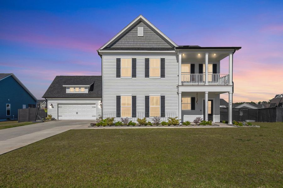 Front exterior of a new home in Timothy Lakes, Ridgeville, SC, highlighting curb appeal (Image 22). Front exterior of a new home in Timothy Lakes, Ridgeville, SC, highlighting curb appeal (Image 22).