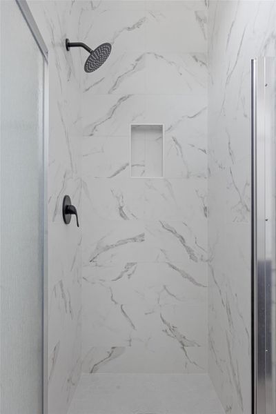 Full bathroom with a marble finish shower Full bathroom with a marble finish shower