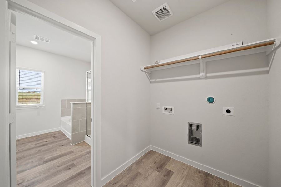 A bathroom with a white wall. A bathroom with a white wall.