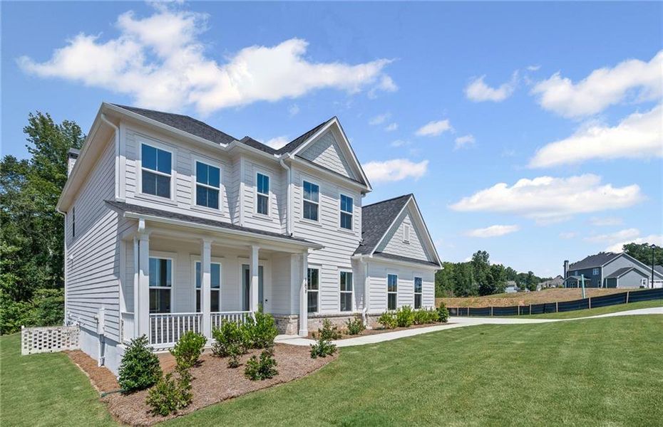Front exterior of a new home in Traditions of Braselton, Jefferson, GA, highlighting curb appeal (Image 20).
