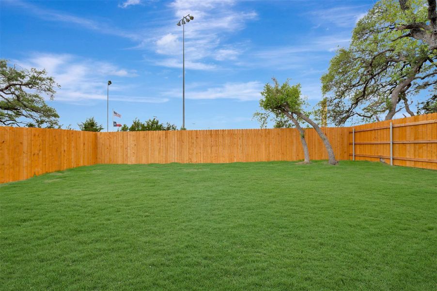 Exterior details and patio area of a home in Heritage, Dripping Springs (Image 10).