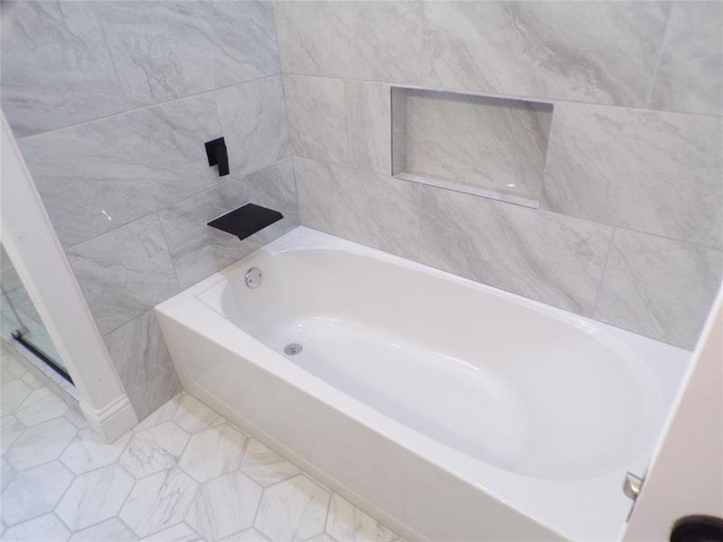 Bathroom with tile patterned floors